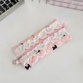 Detail of pink quilted pencil case with lace trim, puppy prints and floral metal zipper pull - Black Cat Pear