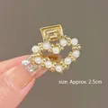 Macro detail of a 2.5cm golden heart-shaped hair claw clip with inlaid white pearls - 4# Heart Pearl