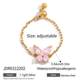 Detail view of adjustable gold butterfly ring with pink zircon and stainless steel chain - Pink Butterfly Style (JDR0312202)