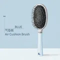 Pastel blue cushion comb with rounded bristles for smooth hair styling and scalp care - Glossy Oval Cushion Brush Blue