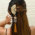 Golden Chinese fan hair pin with blue floral pattern, pearls, and a yellow silk tassel - Green (Left)