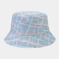 Close-up of a double-sided bucket hat with blue and pink graffiti pattern and stitched brim - One Size / Pale Blue