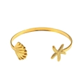 Gold ocean style open cuff bracelet with starfish and seashell charms on white background - Gold Shell Starfish Cuff