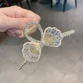 Elegant 11.5cm gold butterfly hair claw clip with rhinestones and faux pearls - Hollow Bowknot Pearl Rhinestone Claw