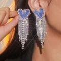 Sparkling blue heart rhinestone earrings with long silver tassels on model - Blue Silver Long Tassel Heart Style (YXE032S)