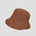 Detailed texture of caramel brown woven straw bucket hat with black metal logo accent - M (56-58cm) / Caramel color