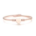 Detailed view of rose gold cable wire bangle with a polished heart centerpiece - Heart Pattern Style / Rose Gold