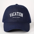 Navy blue cotton baseball cap featuring white Vacation embroidery with adjustable strap - One Size / Navy Blue