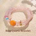 Multi-layer pink crystal bracelet with orange centerpiece and white pearls on beige background - 8# Freshwater Pearl and Rose Quartz Beaded Bracelet