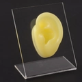 Yellow silicone ear model for jewelry display on a clear L-shaped acrylic stand - Yellow Left Ear