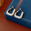 Macro shot of silver square hoop earrings with pavé cubic zirconia on jewelry box - Platinum Plated Copper (With 925 Silver Pin) / Silver