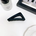 Minimalist matte black triangular hair claw clip with a hollow geometric design - Black
