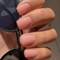 Glossy nude pink medium square press-on nails on a hand holding sunglasses - Medium Square / Nude Pink