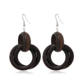 Detail of dark brown layered wooden hoop earrings with silver hooks on white background - Style 25