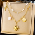 Detail of layered gold necklace with mini pearls, shell and sun pendants on display - Sun Shell Gemstone Multi-Pendant Style (N3362)