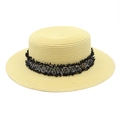 Detailed macro view of woven boater hat featuring fringe ribbon and gold M letter metal logo - M (56-58cm) / Milk Yellow