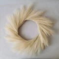 Elegant beige artificial pampas grass wreath in a round radial design for holiday decor - Off White