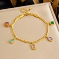 Detailed close-up of a gold-plated bracelet with five multicolor zircon gemstones on a display - Snake Chain Colorful Geometric Zircon Style (B1780)