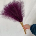 Close-up of 55cm purple faux pampas grass with fluffy feathers for boho home decor - 53-55cm / Deep purple