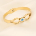 Close-up of golden evil eye bangle with sparkling crystals on beige silk fabric - Single Evil Eye Zircon Style (2#)