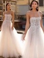 Detail of white strapless wedding dress with floral lace embroidery and sheer tulle fabric - US 2 / White