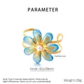 Detailed view of gold plated stainless steel flower bangle with blue enamel and pearl inlay - Gradient Blue Enamel Flower Pearl Style (KB206408-SP)