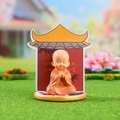 Zen Monk crystal figurine in orange robe sitting on a lotus base with a pagoda backdrop - 1034-23D Tranquil Spirit Set