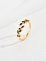 Detailed view of adjustable gold leaf ring set with sparkling black marquise zircons - Black