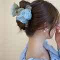 Green and blue fabric lily flower hair claw clip displayed on a female model - Green Flower Claw Clip (124#)