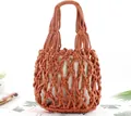 Detail of handmade red cotton rope woven beach bag with beige inner drawstring pouch - Orange