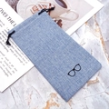 Linen drawstring sunglasses pouch in light blue with minimalist glasses icon - Blue