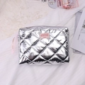 Silver quilted makeup bag with pink ribbon and loving message label in a soft setting - Clutch Bag / Silver (Party Girl)