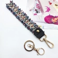 Detail of colorful woven wrist strap with gold carabiner and leather fastener - With Keychain / Pale Blue