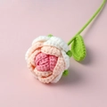 Detailed macro of a handmade crochet rose showing delicate pink and white yarn layers - Gradient Korean Pink Rose