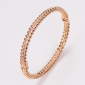 Minimalist rose gold stainless steel bracelet with textured rivet pyramid studs - Rose Gold