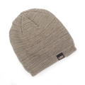 Detail of earthy brown knit beanie showing textured ribbed patterns and black logo label - One Size / Khaki