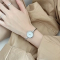 Elegant women's silver twist bangle watch with a minimalist white dial on wrist - No Scale Silver Band White Dial