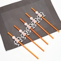 Halloween party straws set featuring 6 orange plastic straws with white skull decorations - Long Style / Orange Skeleton