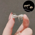 Golden bow brooch with sparkling rhinestones and a secure butterfly pin clasp - Bowknot Brooch (40111E)