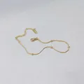 Close-up of 18K gold snake chain necklace with beads and K18 hallmark on the tag - Gold (s626 Bead Bracelet)