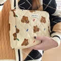Quilted beige cosmetic bag featuring brown bear patterns and a soft cotton-padded design - Clutch Bag / Brown Bear