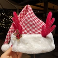 Christmas hat with red houndstooth pattern, white plush trim and sparkling sequin antlers - Bell Flower Antler Christmas Hat