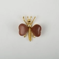 Gold butterfly brooch with reddish-brown natural crystal wings on a white background - Gold Sandstone