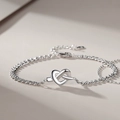 Elegant silver double-layer bracelet featuring a central heart knot in polished finish - Concentric Knot Bracelet Men