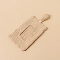 Detail of baby wipes storage bag with cream cotton texture and hanging button strap - Apricot