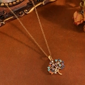 Golden Tree of Life necklace featuring colorful rhinestones on a textured brown backdrop - Gold Colorful Tree Necklace (T031)