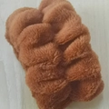Soft plush bow-style hair scrunchie or wristband in brown finish on wood background - Caramel Wristbands 1 Pair
