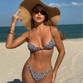 Sexy leopard print bikini set with pearl accents and adjustable thin straps on a beach - S / Coffee