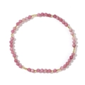 Pink faceted gemstone beaded bracelet with gold spacers on white background - Strawberry Quartz / Pink