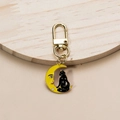 Detail of yellow moon and black cat metal keychain charm with golden spring clasp - Yellow Moon-Large